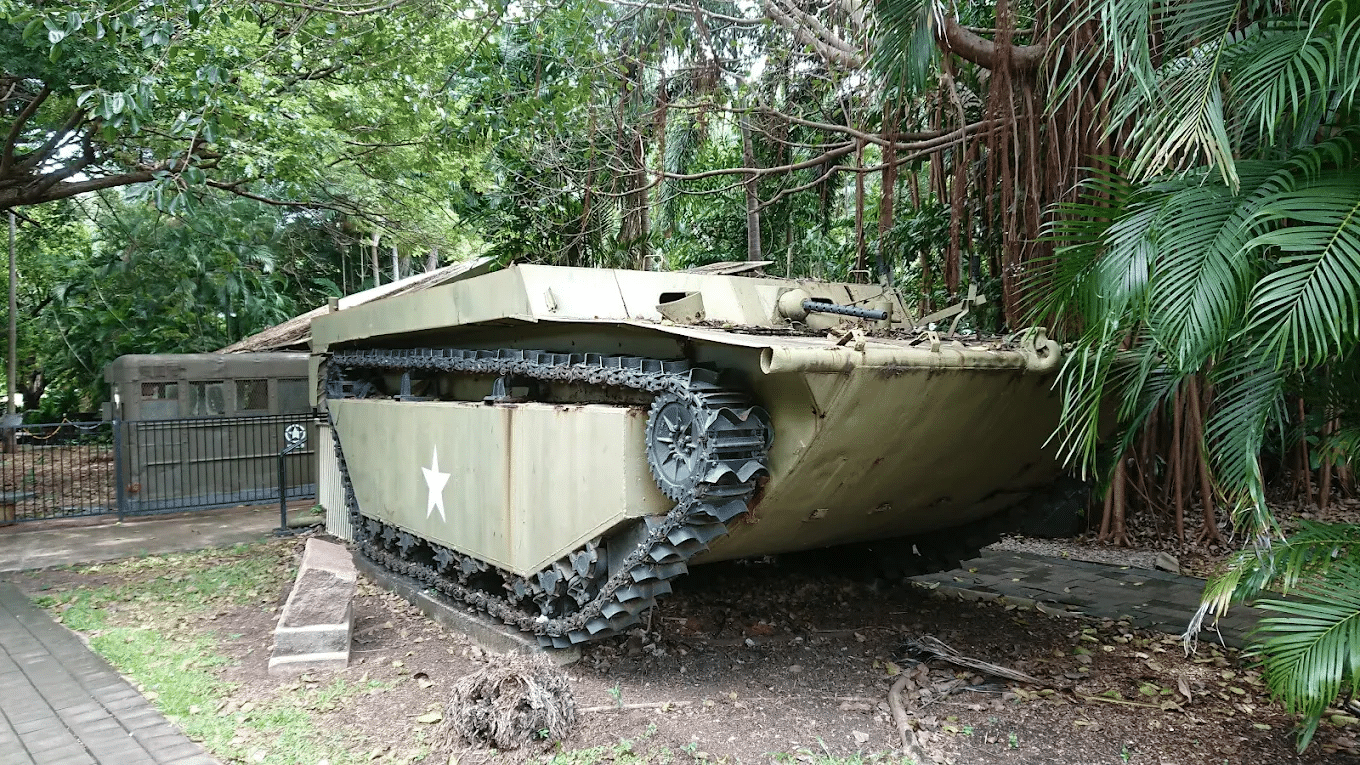 Military tank in forest during school excursion in Darwin