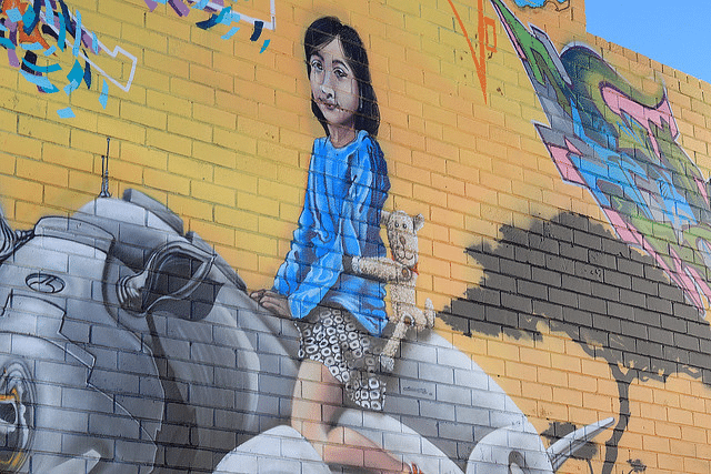 Mural of woman with cat on building in Perth