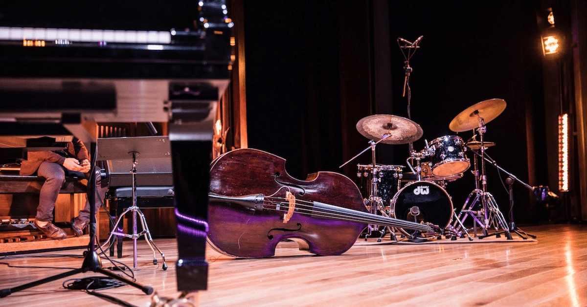 Musical instruments on hardwood floor in Brisbane music venue