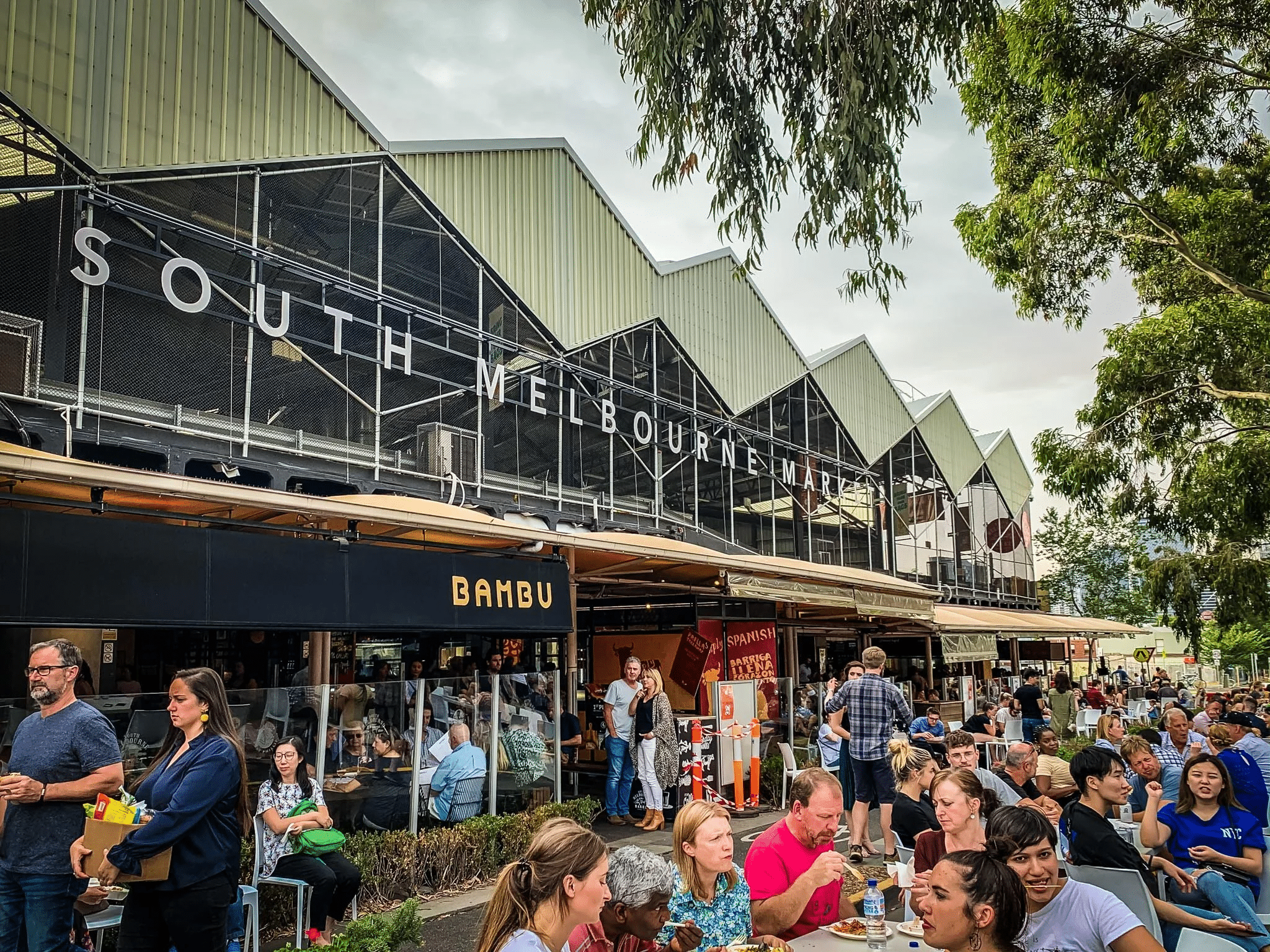 People dining outdoors in Melbourne food tour