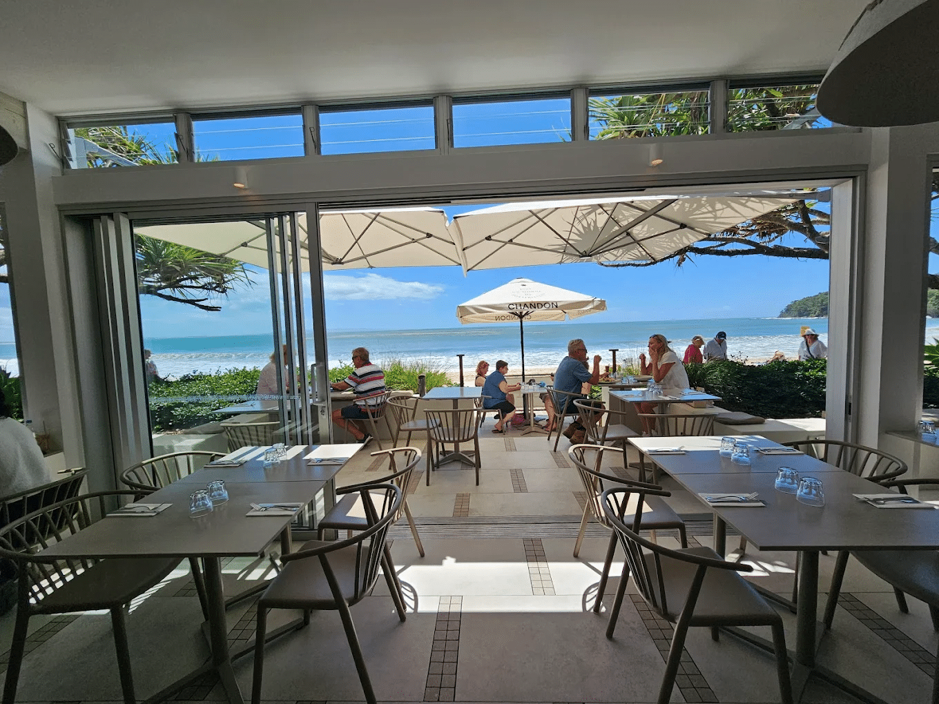 People dining under umbrellas in Sunshine Coast