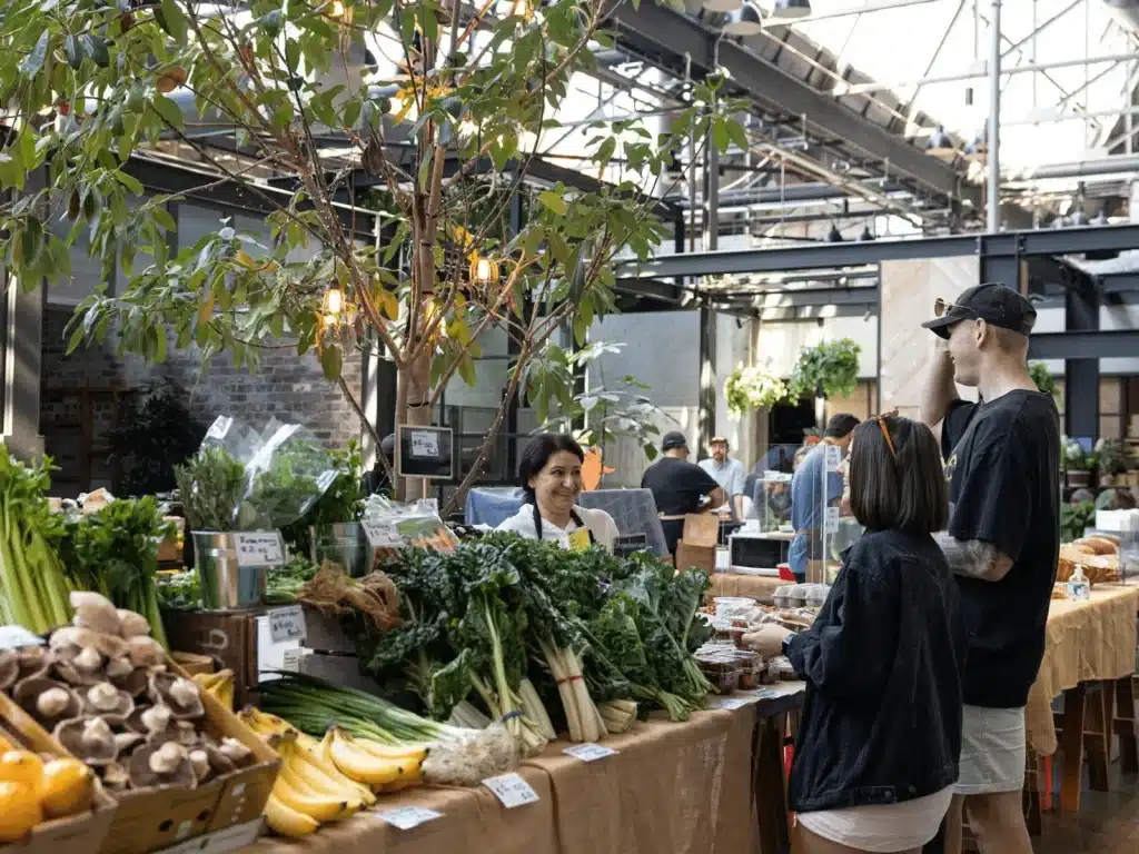 People enjoying fresh vegetables on a Sydney food tour table