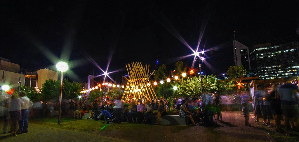 People gathered in a Brisbane park at night