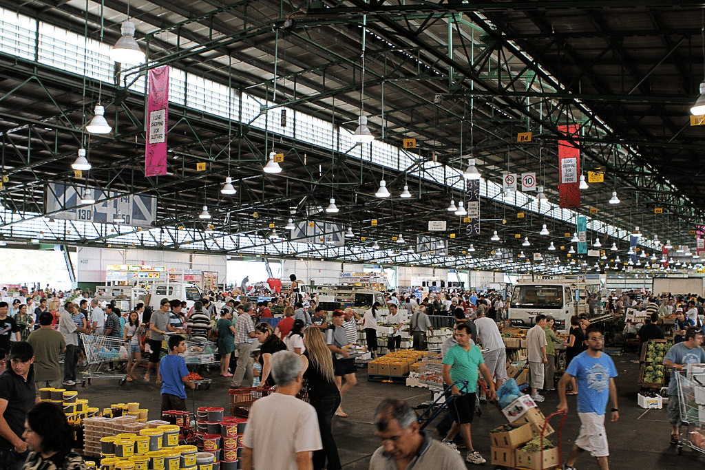 People gathering in a warehouse for Sydney food tour event