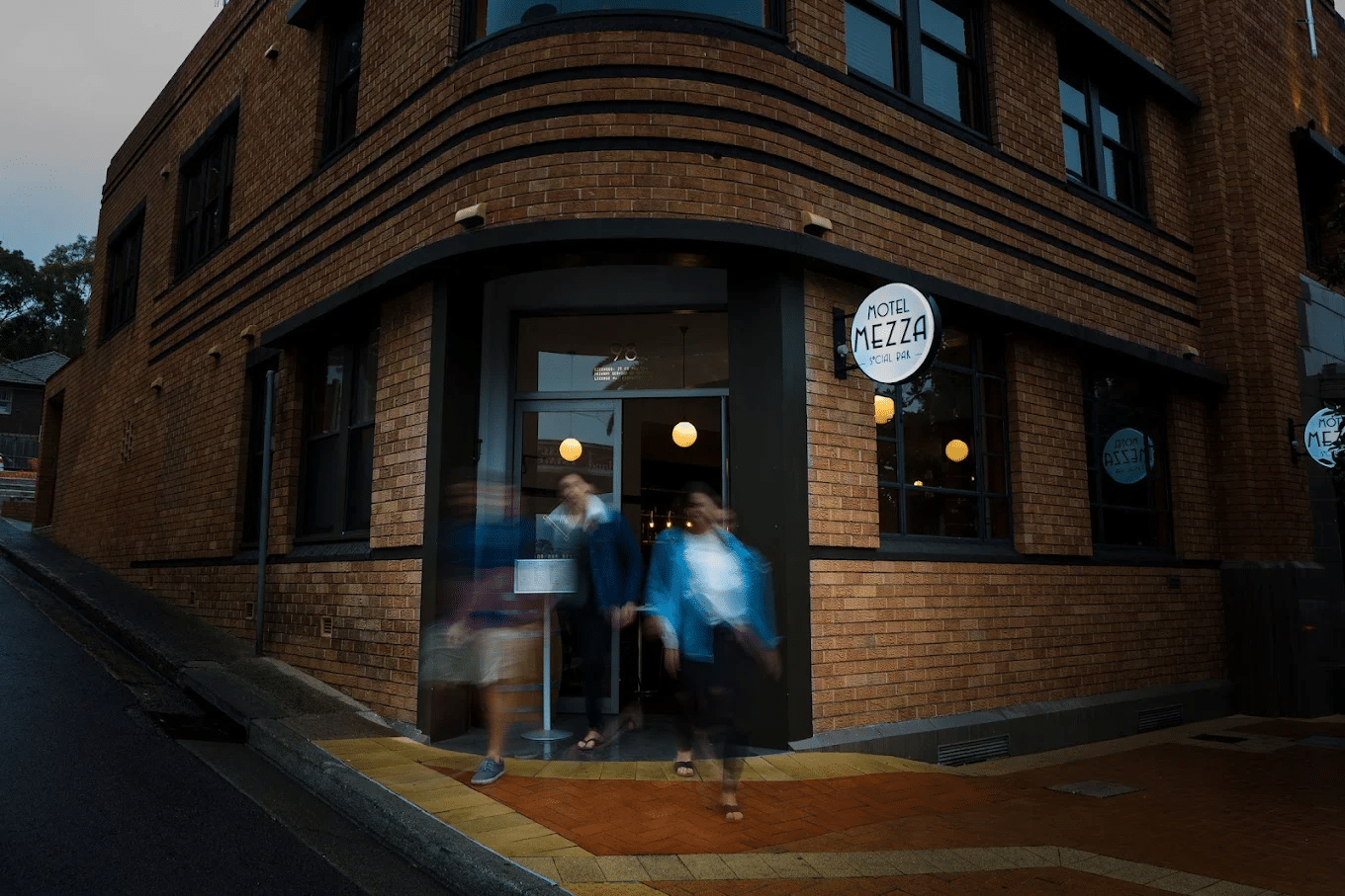 People leaving a brick building after food tour in Central Coast