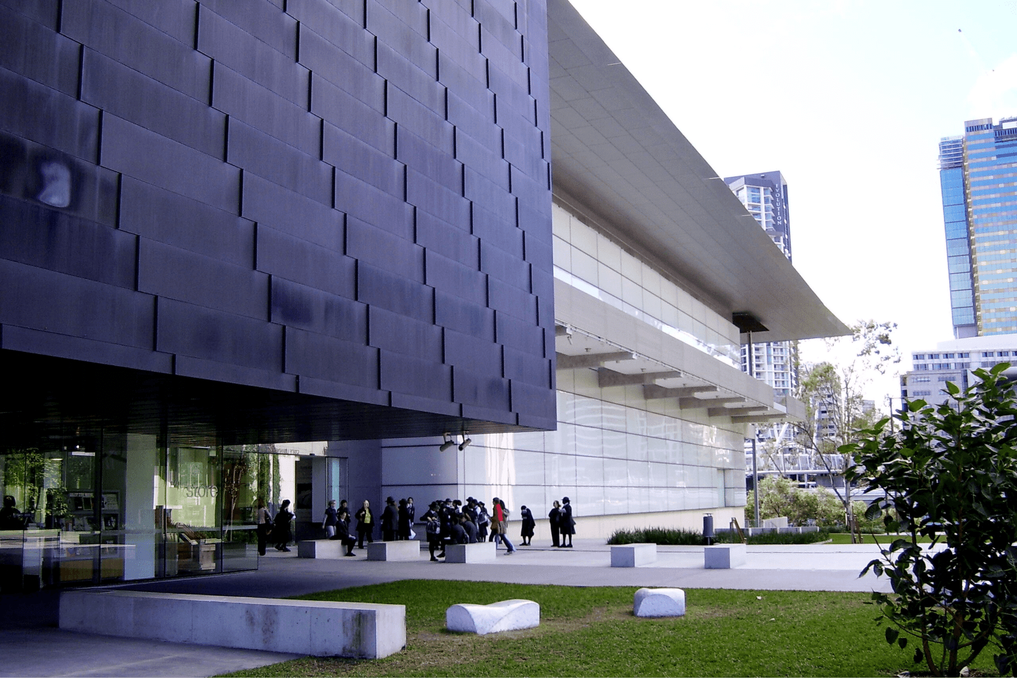People outside a building in Brisbane during autumn