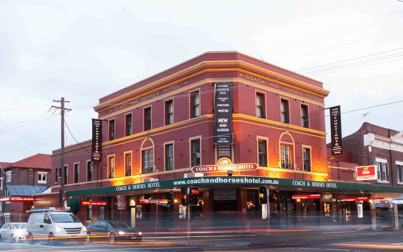 Red brick building with green awning in Randwick