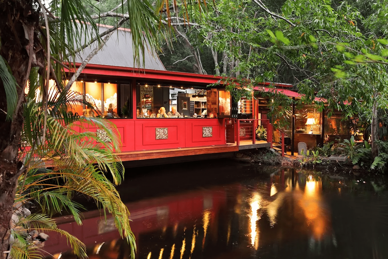 Red house by a river and forest in Sunshine Coast
