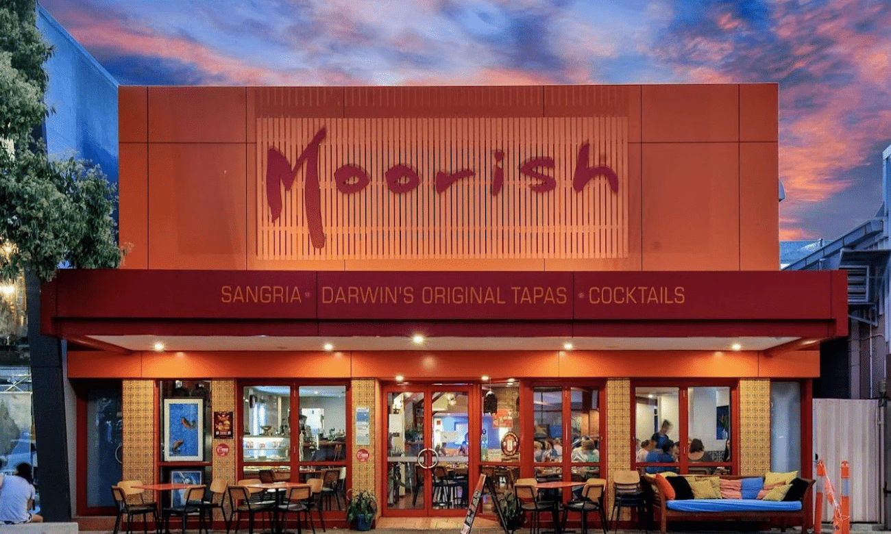Restaurant exterior with dining tables and chairs in Darwin