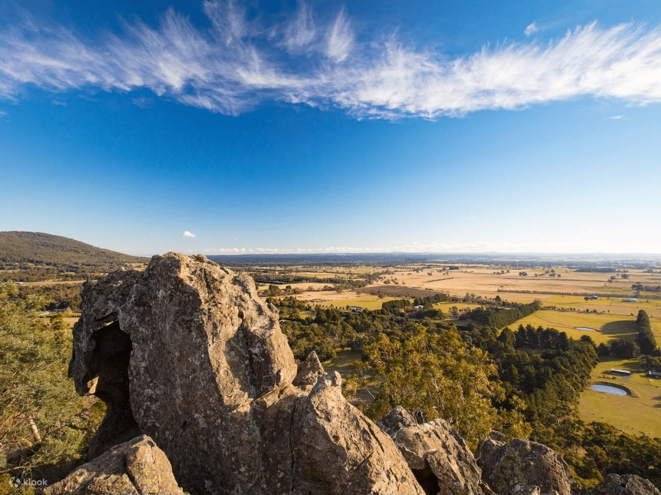 Rocky outcropping overlooking a distant valley near Melbourne