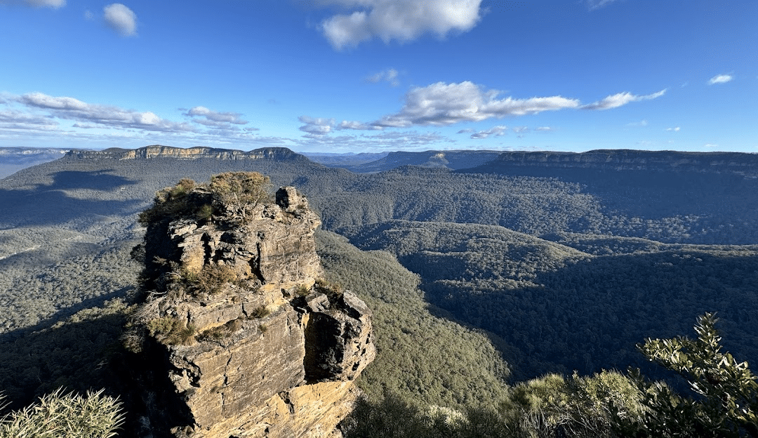 Rocky outcropping with trees and mountain view in Sydney winter