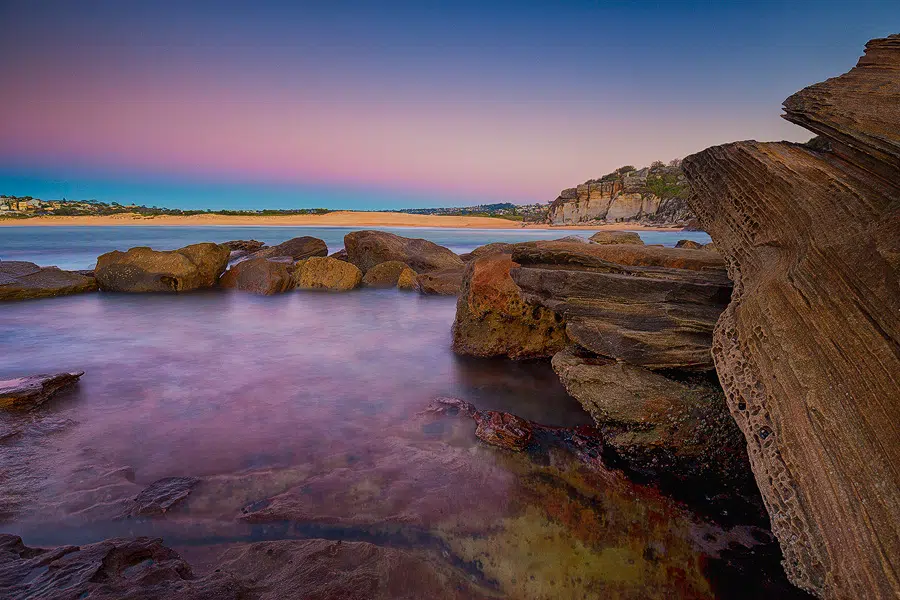 rocky shoreline and water at sydney s natural attractions.png