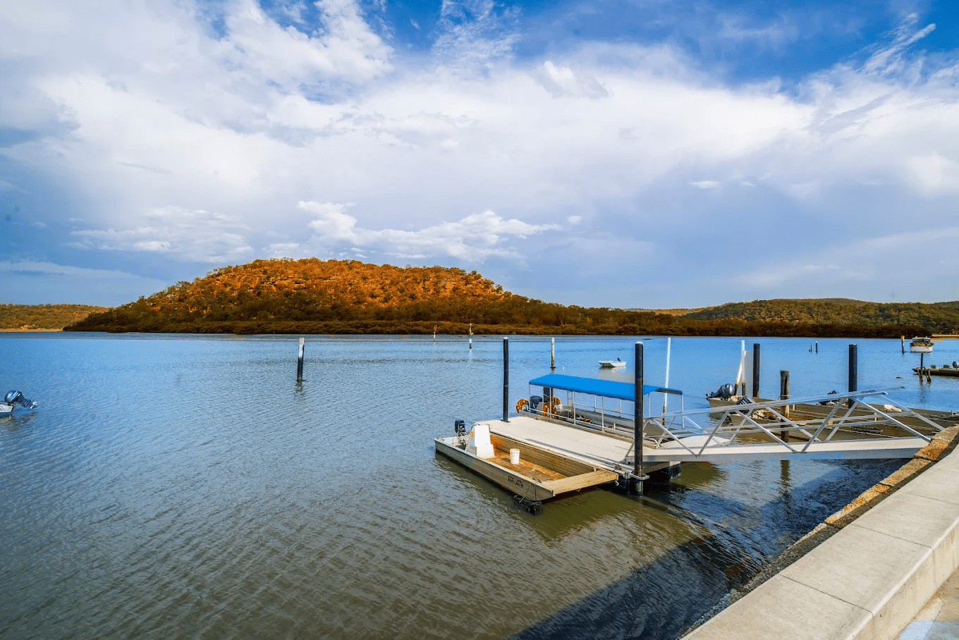 Scenic boat dock on a lake with a mountain view in Central Coast