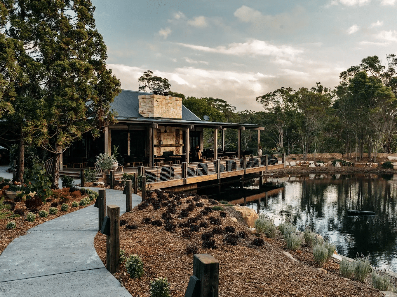 Scenic house on green hill near lake