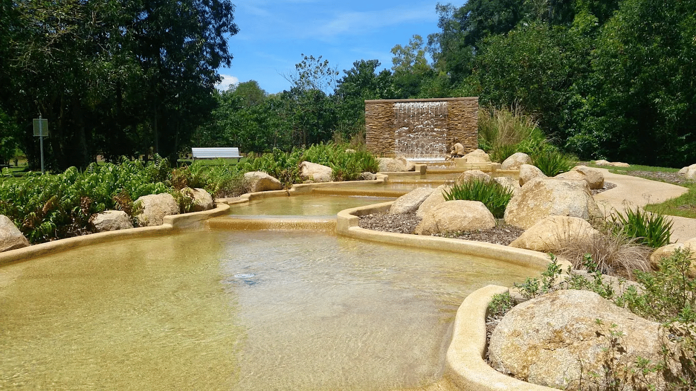 Scenic small pond with rocks and lush plants