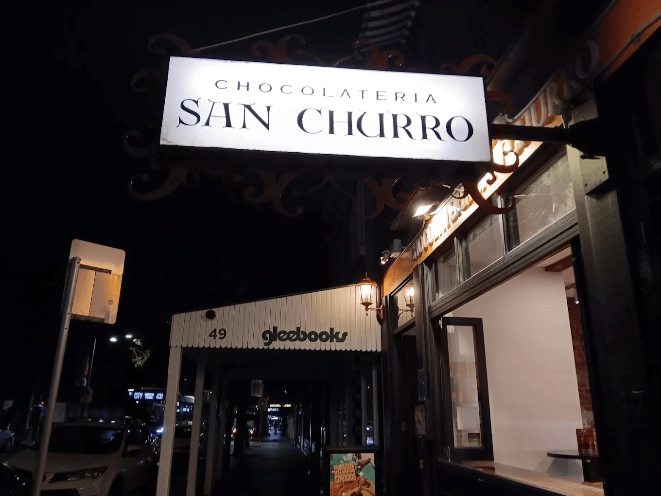 Sign for chocolateria san churro in glebe at night
