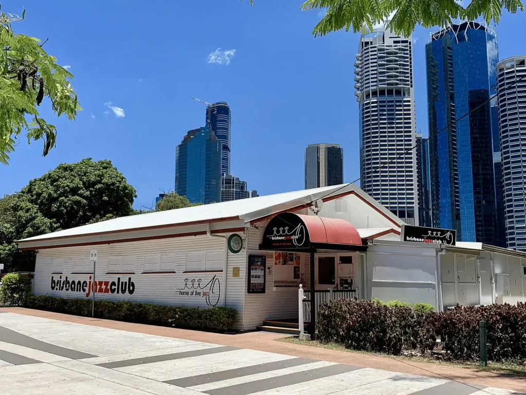 Small white building with red roof at Brisbane music venue