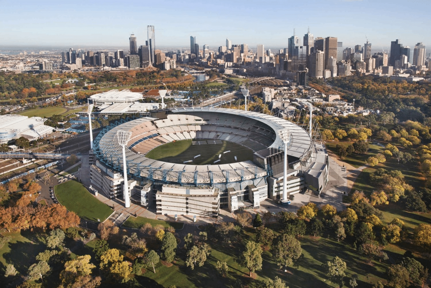 Stadium aerial view with Melbourne cityscape