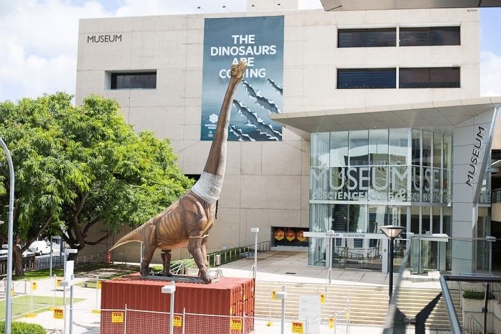 Statue of a dinosaur outside a Brisbane museum