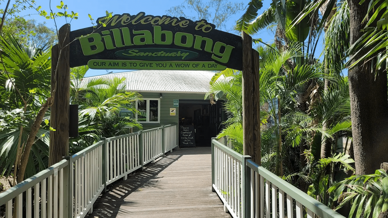 Welcome sign to Billabong in tropical setting near Townsville