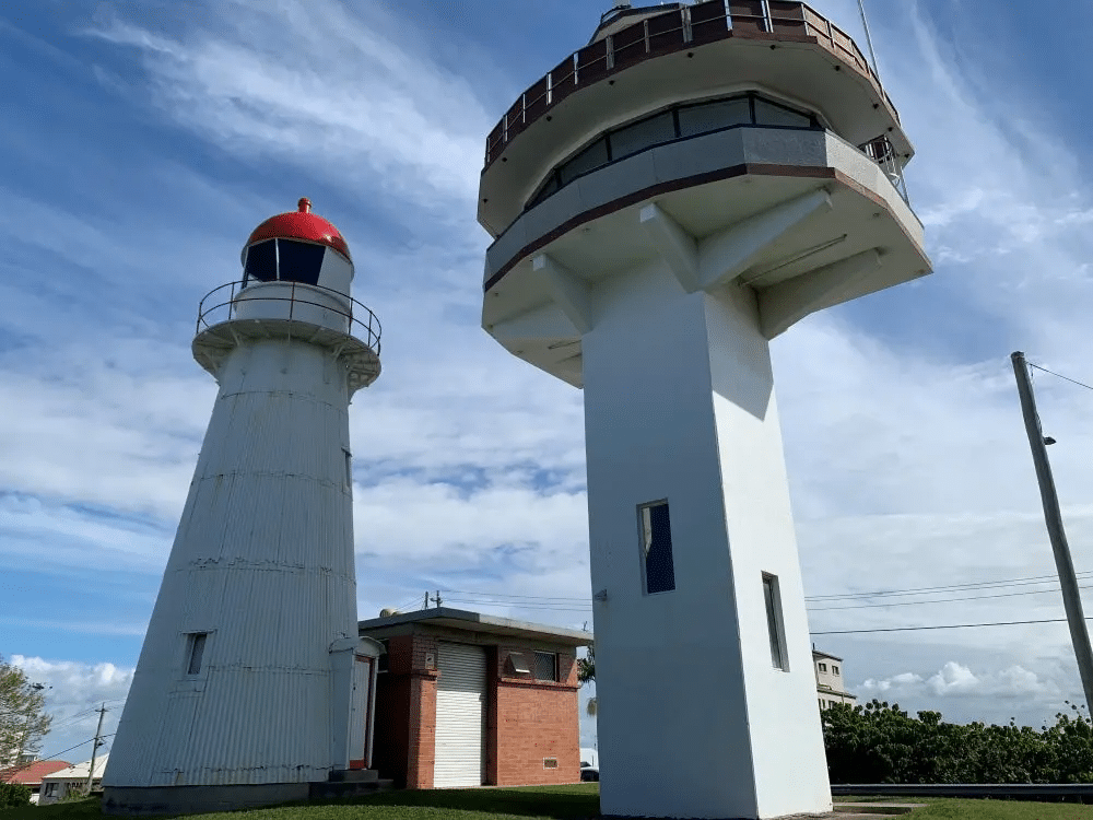 White lighthouses on lush green field