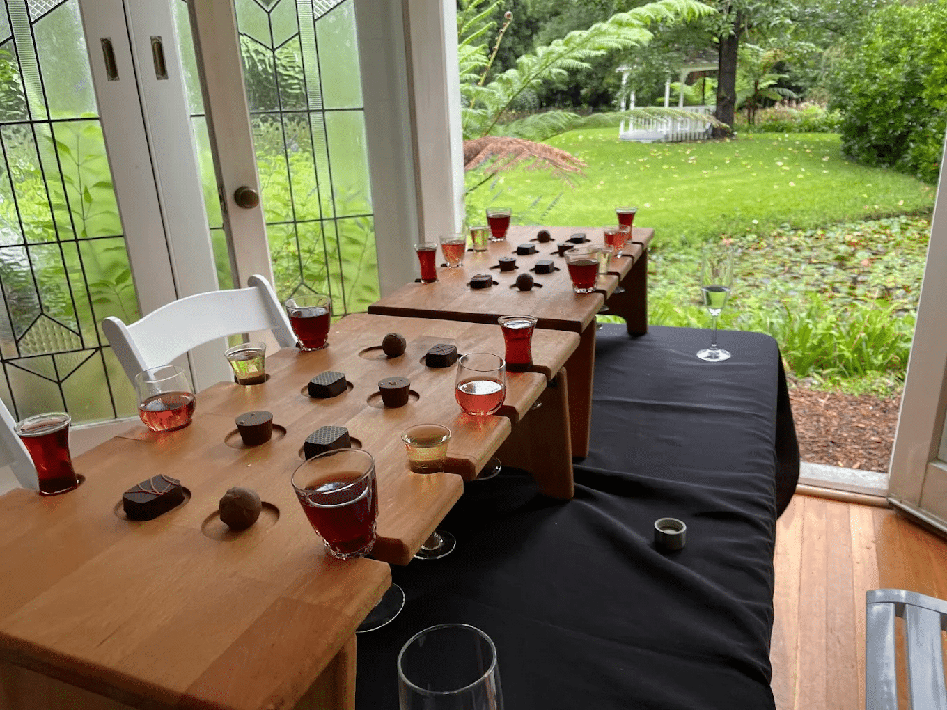 Wine glasses on a long wooden table