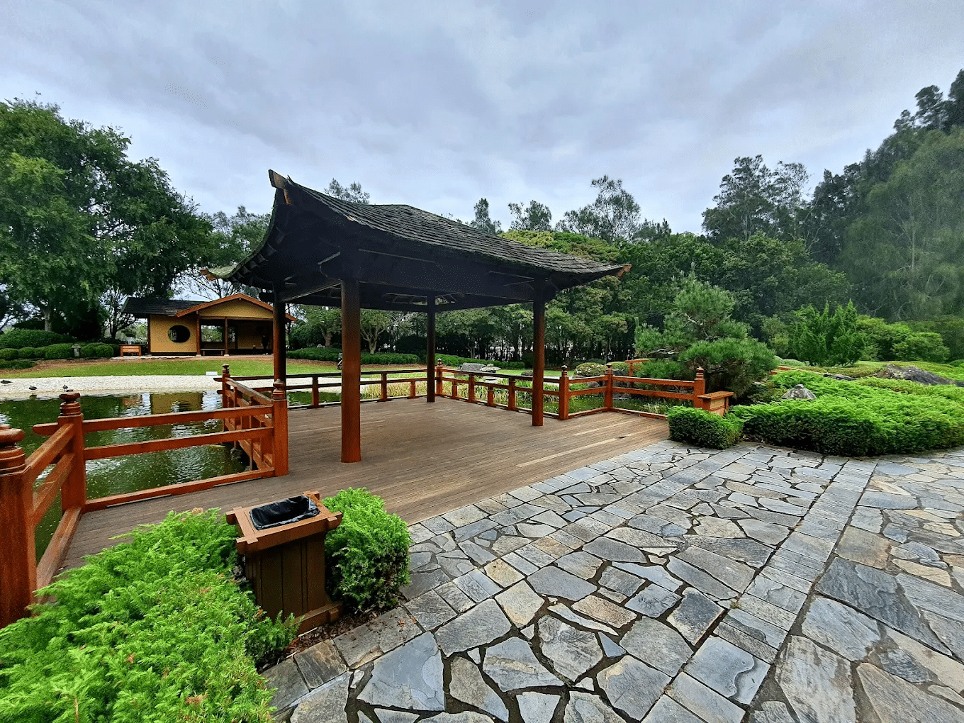 Wooden gazebo on a stone path in a Central Coast park