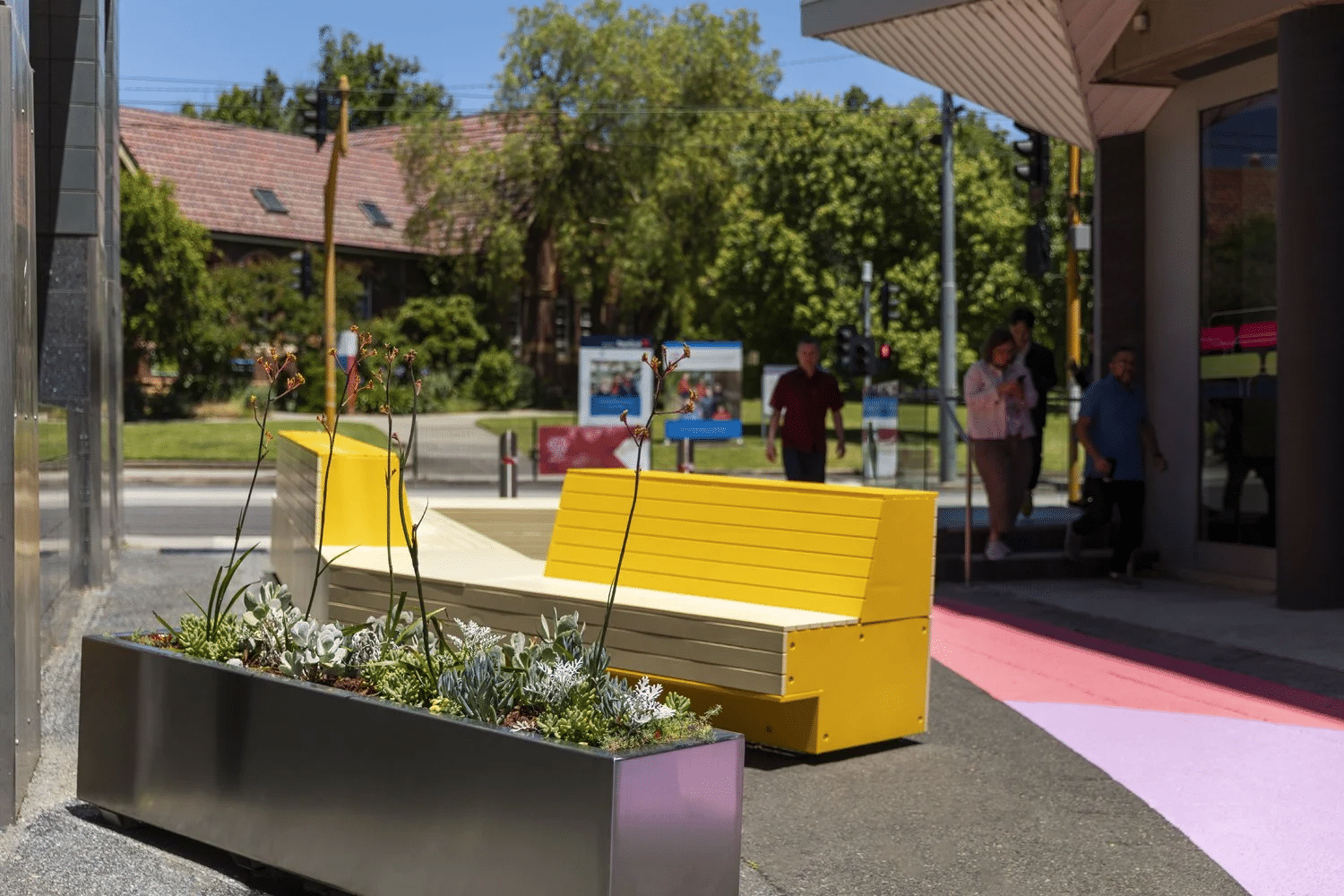 Yellow bench by road in Boroondara, Melbourne suburb
