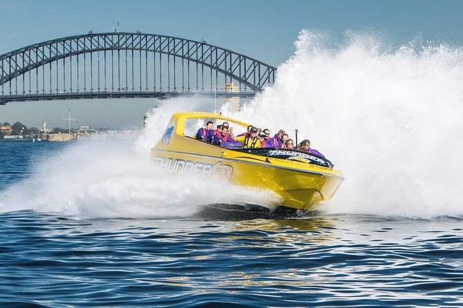 Yellow speed boat on Sydney waters with passengers