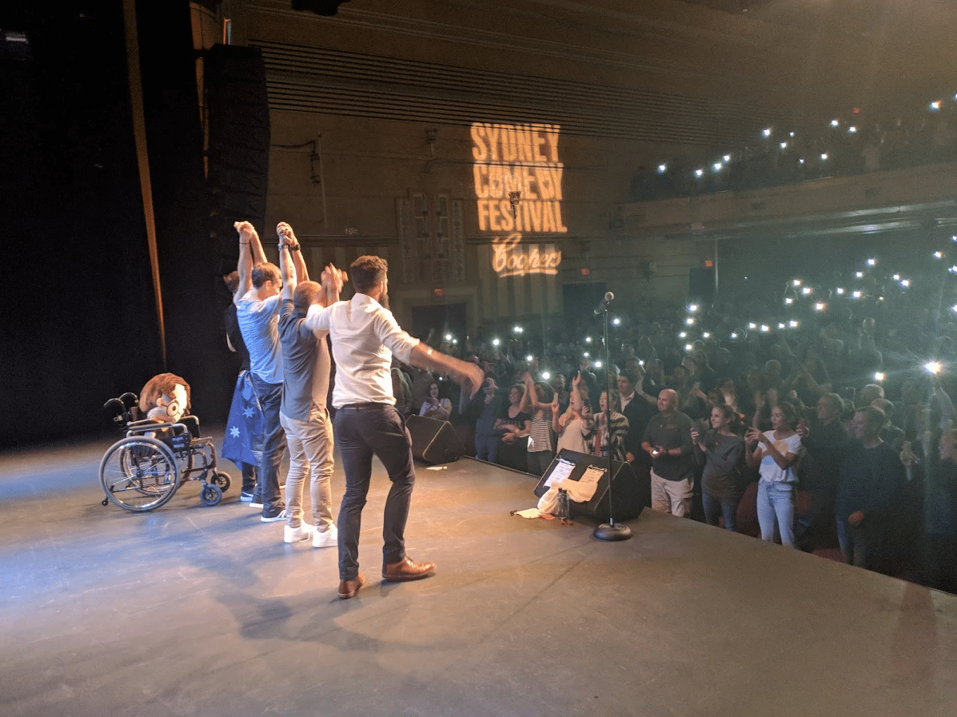 Young adults on stage during Sydney event